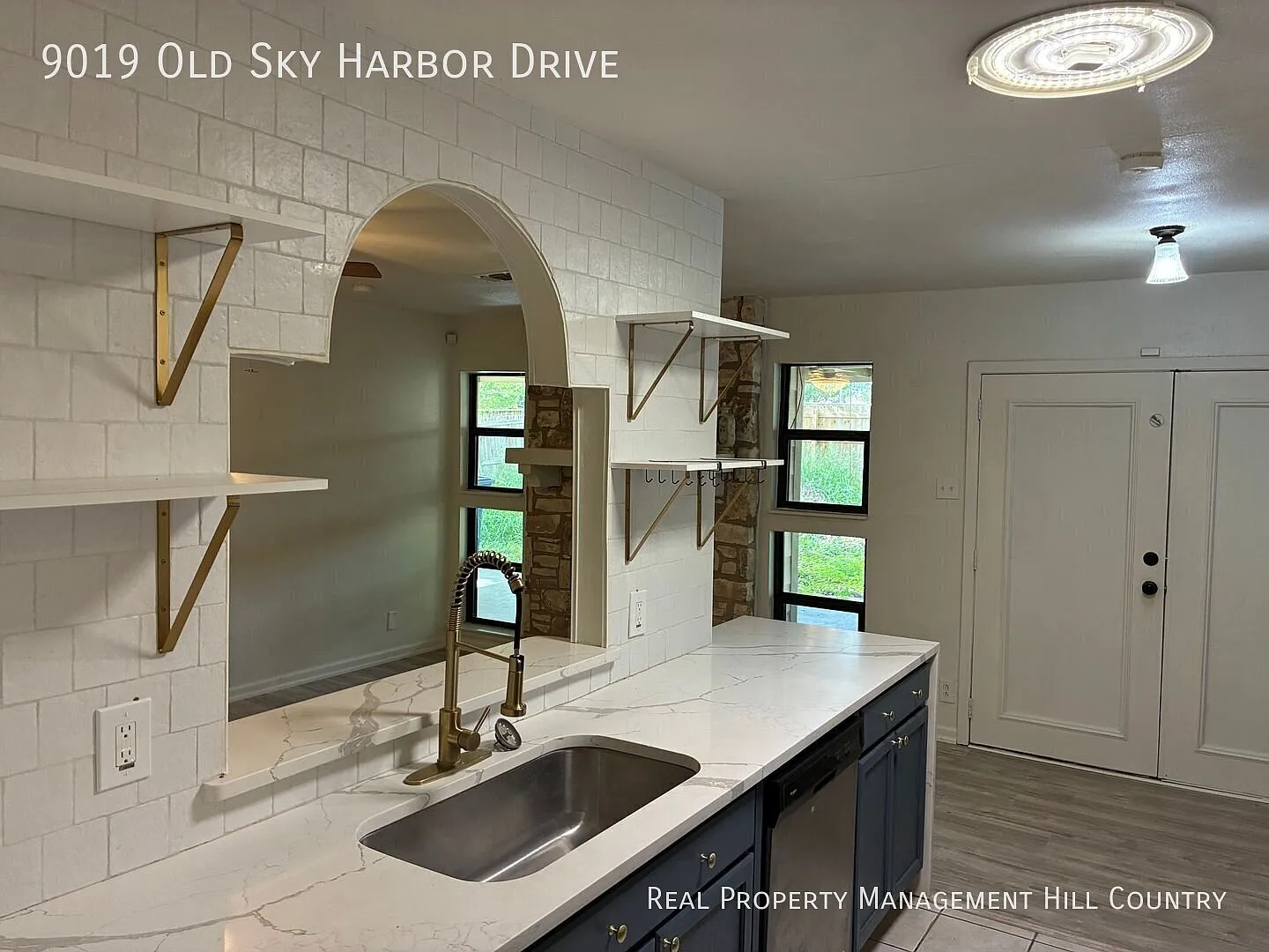 Renovated 5 Bed 2 Bath with Stone Fireplace + Quartz Kitchen — Photo 4