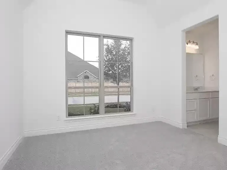 Front bedroom facing the street. Bathroom on the right.