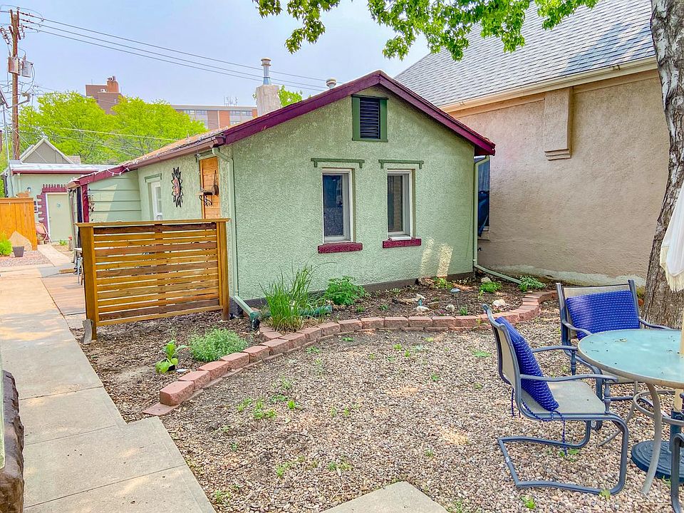 Private, historic carriage house set back from the street.