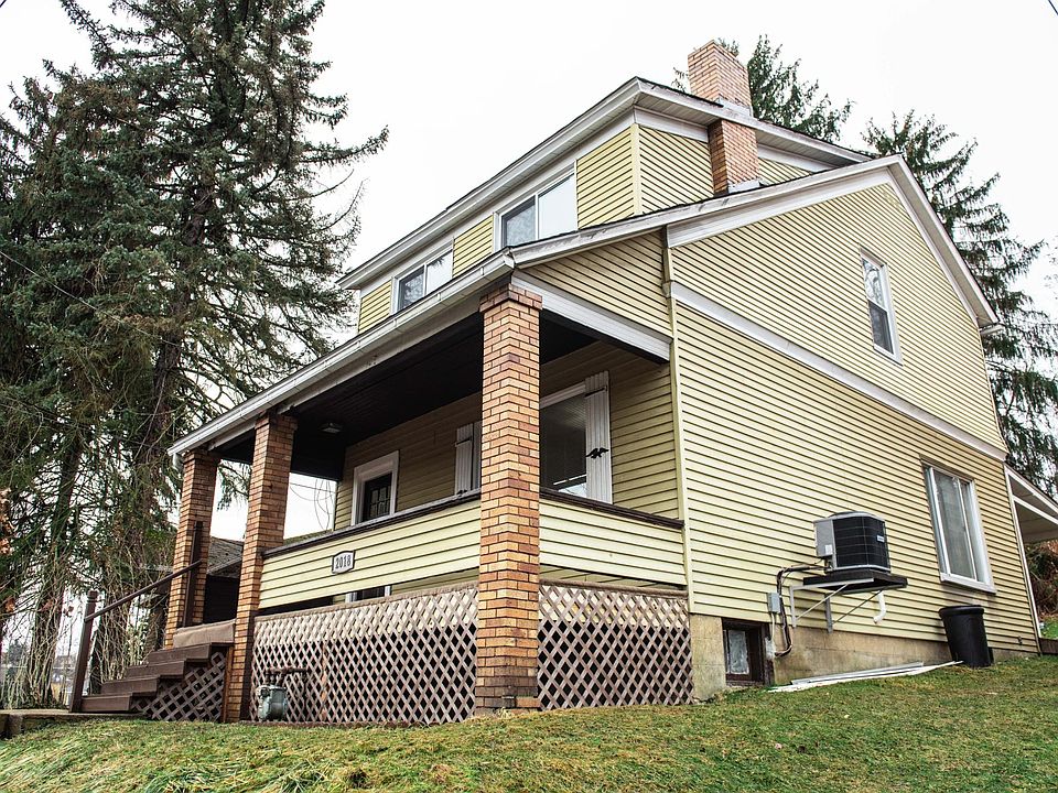 This large two-story home features both front and rear covered porches, offering plenty of outdoor space to relax, entertain, or enjoy the seasons in comfort.
