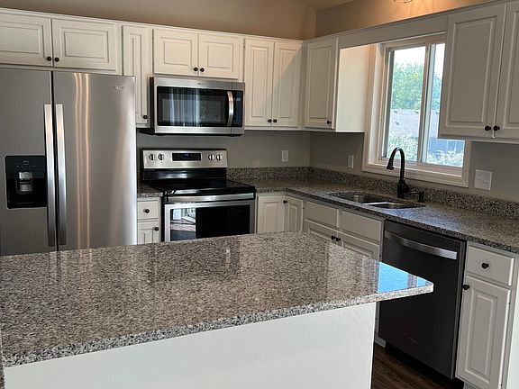 Remodeled Kitchen with stainless appliances and granite countertops.