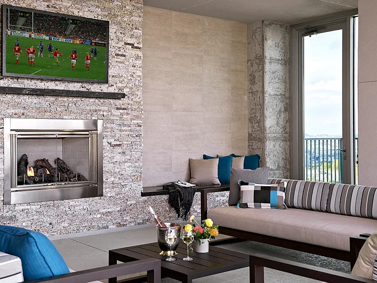 SkyDeck with lounge seating, TVs and fireplace
