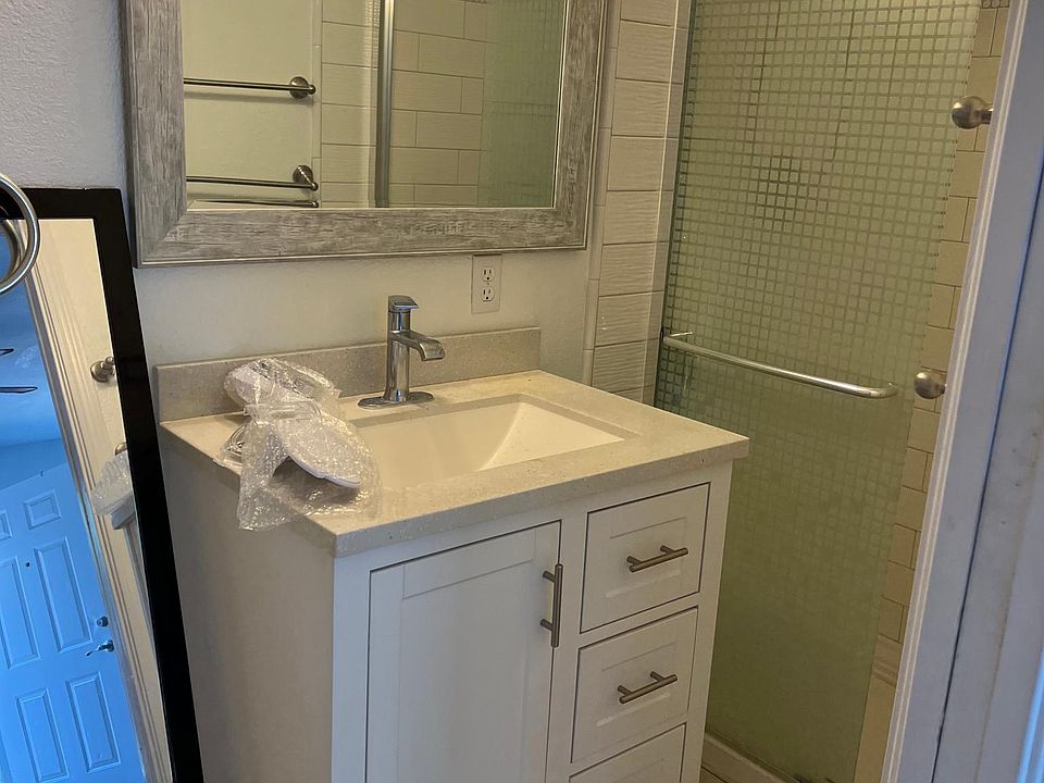 sink , mirror , cabinets , shower