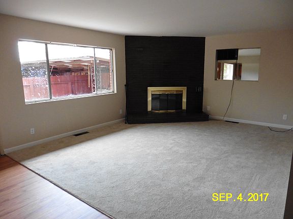 UPDATED PHOTO: large living room with new carpet and paint,