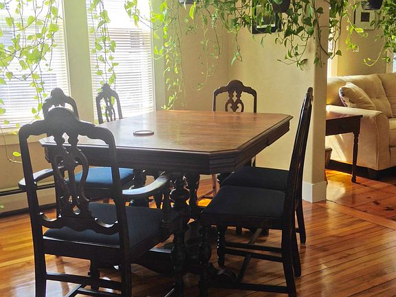 Dining room with furniture in it.