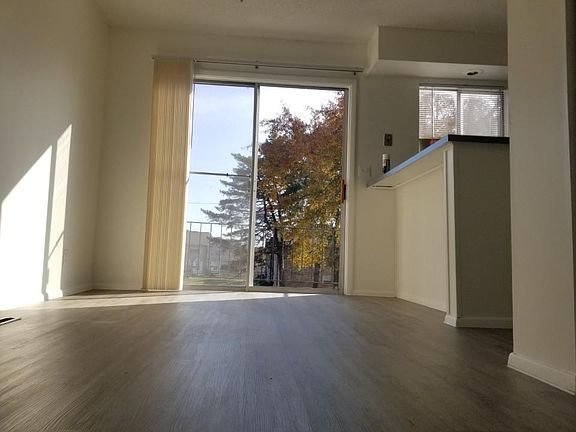 Dining area and kitchen with door to balcony