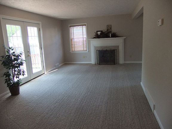 Living Room with New Carpet, French Doors & More