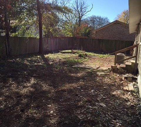 BACK YARD WITH STEPS FROM KITCHEN