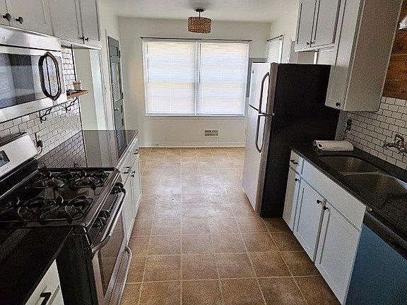 Kitchen with eat in area.