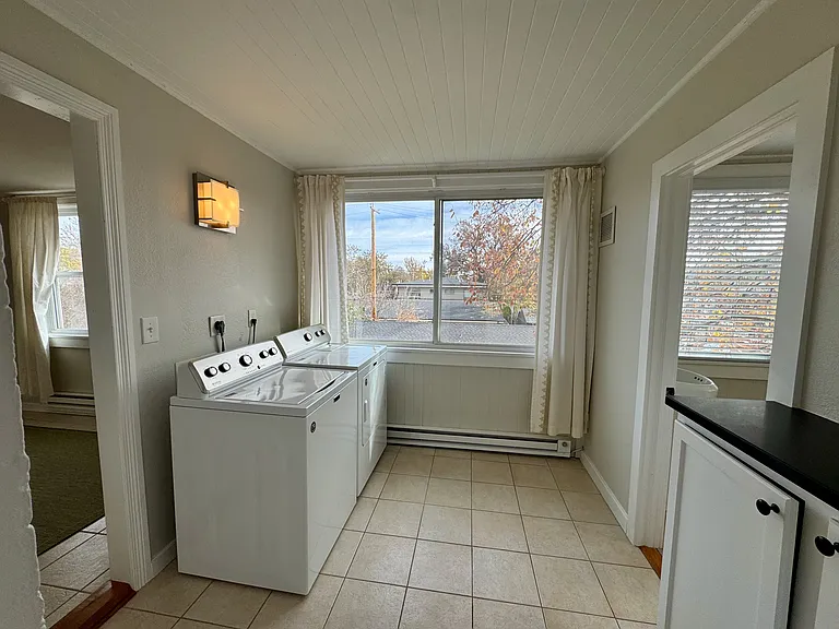 Laundry room with fullsize washer and dryer