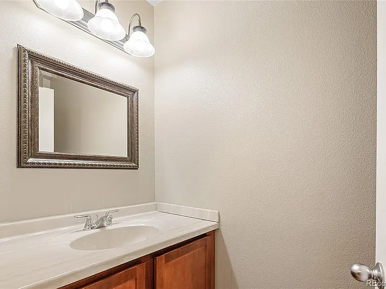 Main floor half bath (upgraded fixtures and toilet not pictured).