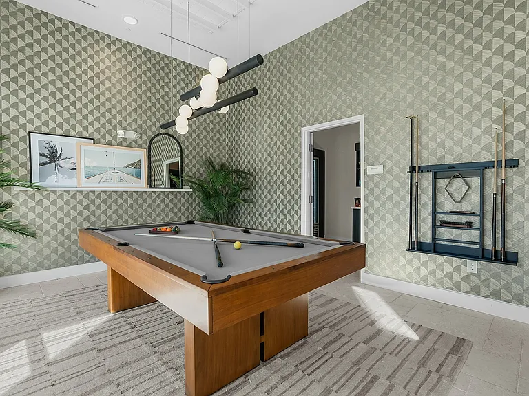Experience leisure in style with this modern game room, blending elegance and functionality.