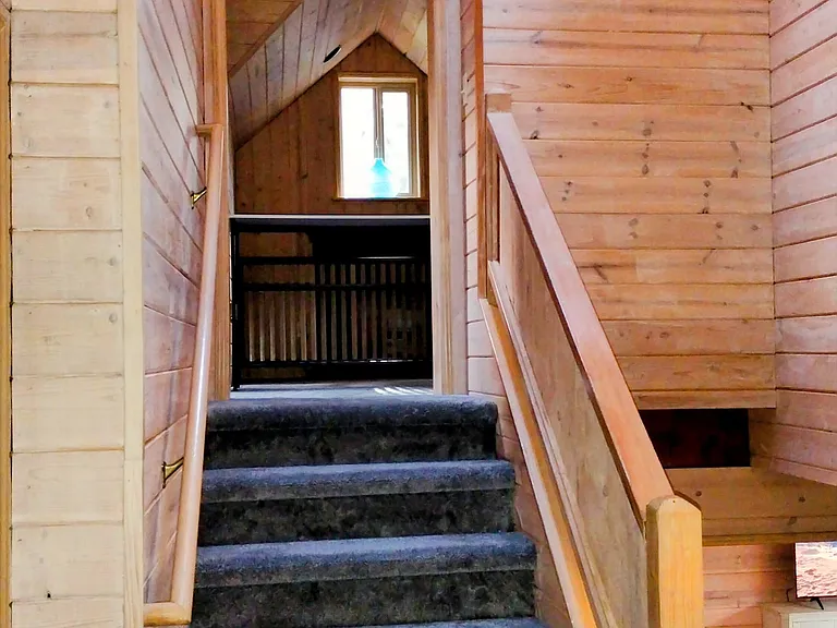 Pine lined walls and ceilings add to the comfort and quietness of this home.