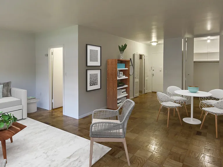 Living Room with Parquet Wood Flooring and Closet Space