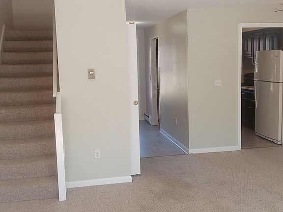 Unit front entrance view into the living/dining area.