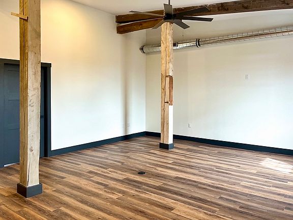 Living room view. This apartment has dimmable spotlights and ceiling fans throughout.