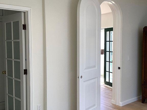 Solid core arched bedroom door.