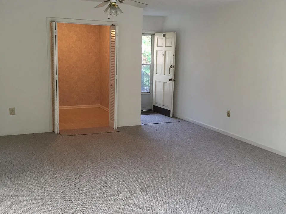 Looking to front door and kitchen dining area