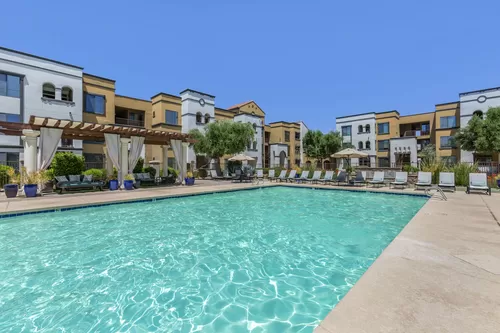 Treat yourself to a refreshing swim at Trevi Apartment Homes, where our amenities include a sparkling pool for your enjoyment - Trevi Apartment Homes