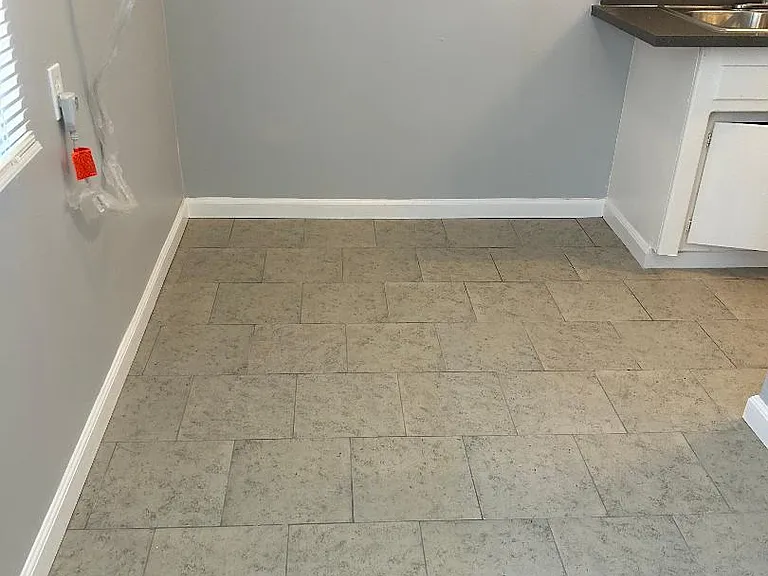 dining area with brand new tile floor and new paint