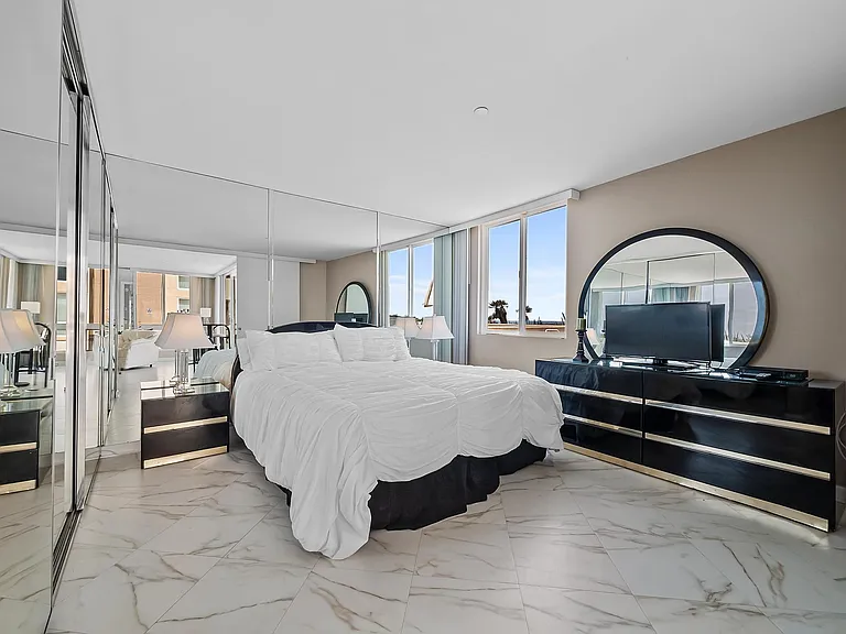 master bedroom with oceanfront view of ocean