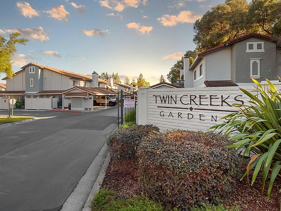 Sign by community entrance with apartment name.