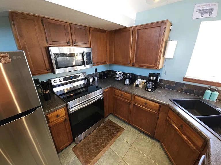Kitchen with Keurig and 12 cup drip coffee pot