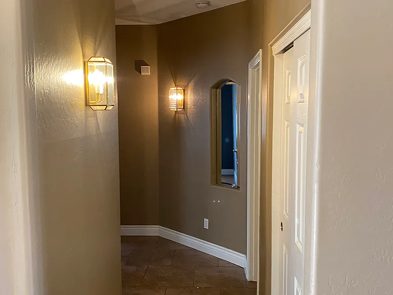 Hallway to guest rooms and guest bathroom.