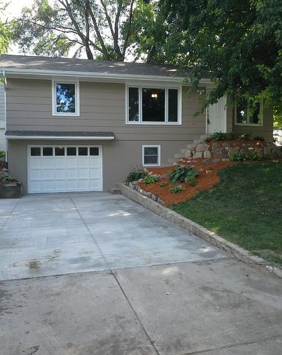 New roof,exterior paint,cement driveway,garage and landscaping