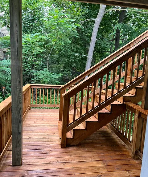 Enjoy a private deck with a peaceful wooded backdrop - a rare outdoor retreat just minutes away from downtown Ann Arbor and campus