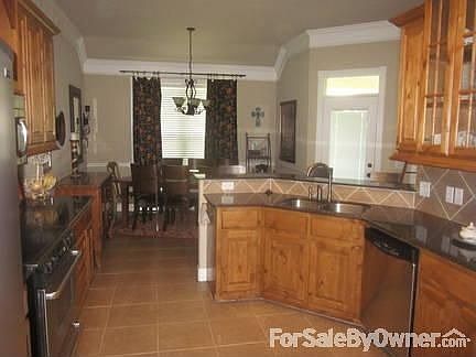 Kitchen
						:
						Granite, Maytag appliances, walk in pantry and tile floors.