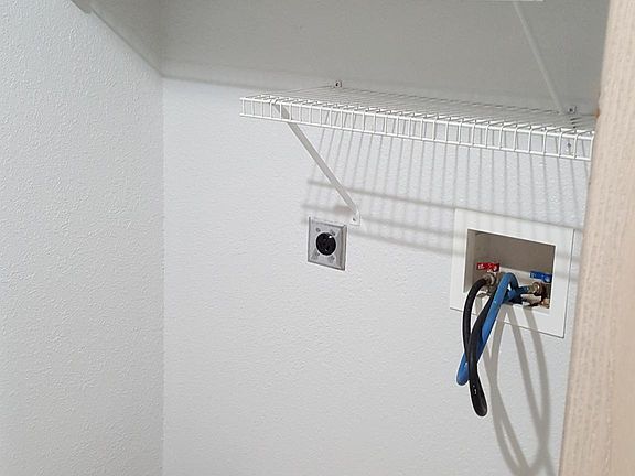 Laundry Closet with washer and dryer hook ups