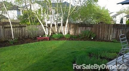 Back of house
						:
						Large wood deck with partial cover