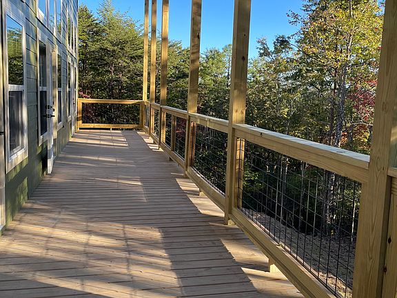 Large deck with private wooded views. I eventually cut trees down to establish longer range views, but right now isn't a priority.