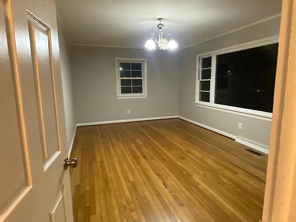 Front living area /Dining hall with a Large picure window facing the street
