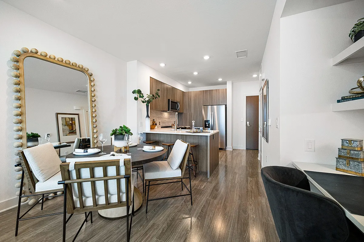 Dining nook with mirror and cozy seating beside kitchen - The Overlook at Walnut Creek
