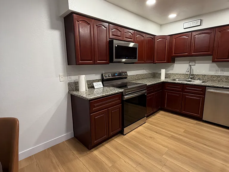 Additional kitchen view with abundant cabinetry and functional storage