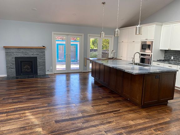 Kitchen Island with Wet Bar/Prep Sink. All shelves pull out. Two Pantry Cabinets.