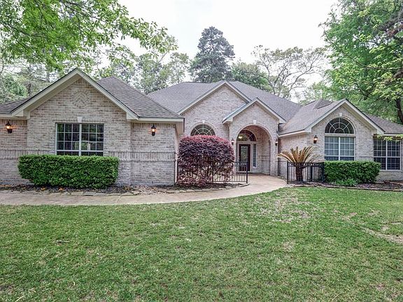 Large front patio compliments the architecture of the home.