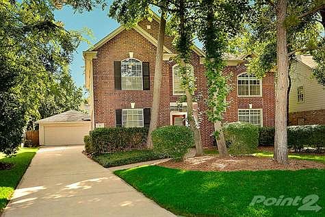 Professionally landscaped front yard.