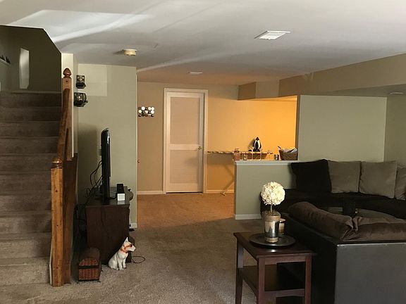 Downstairs finished family room as you enter through the front door