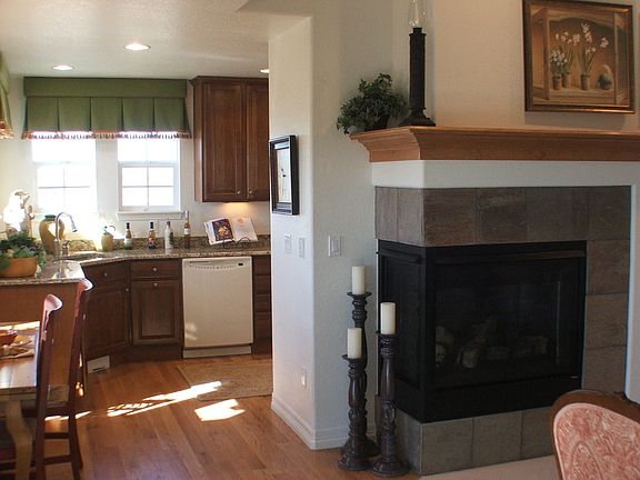 Breakfast Nook with fireplace and wood flr.