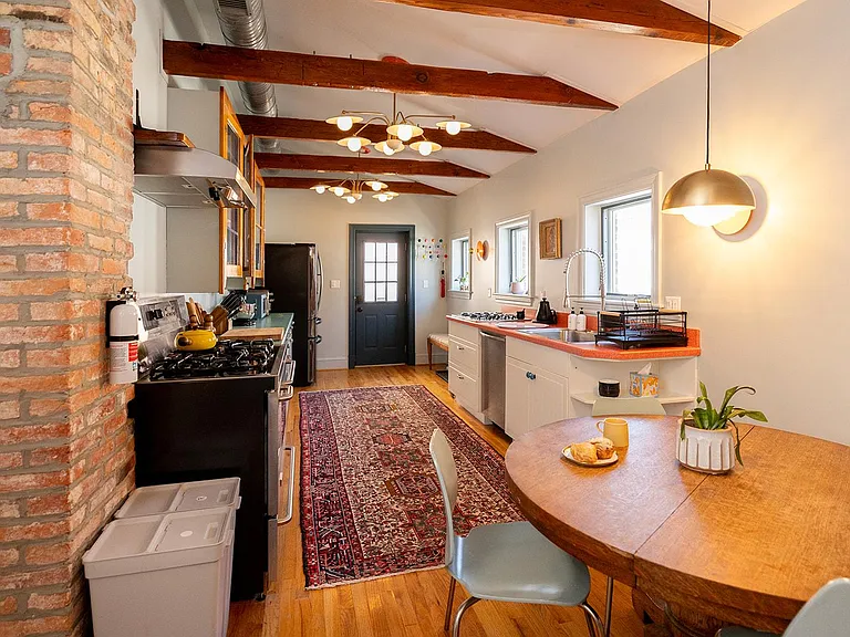 Our kitchen is flooded with natural light streaming in from three large windows!