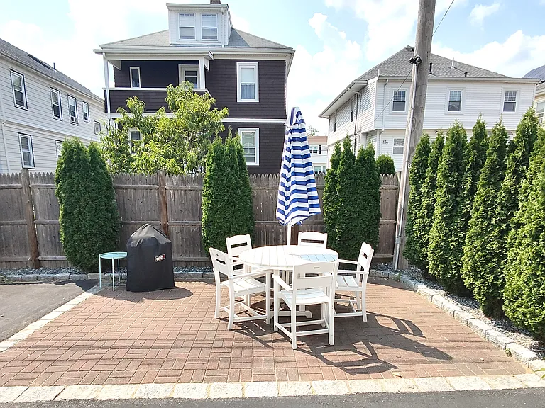 Shared patio and landscaped yard.