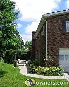 view of one of the perenniel beds and patio