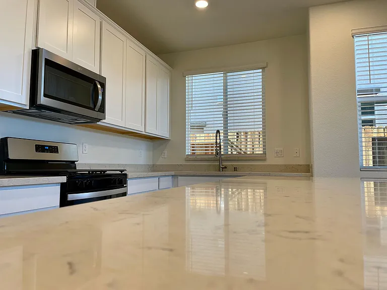 Large kitchen island with Quartz on top