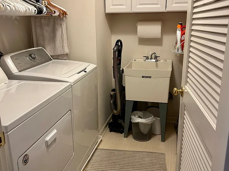 2nd floor laundry room with utility sink