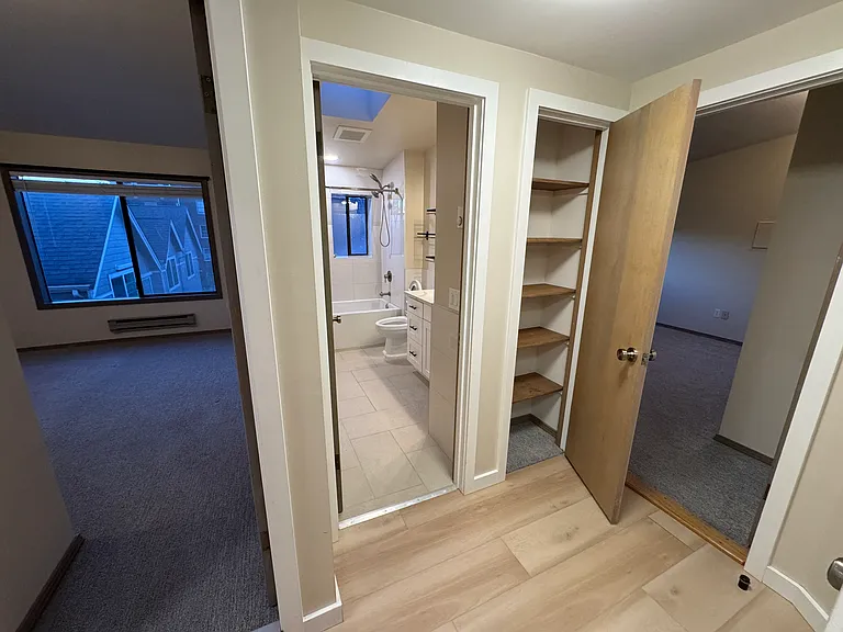 First bedroom, bathroom, linen closet, and primary bedroom