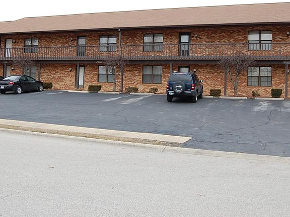 Outside of unit with Off street parking