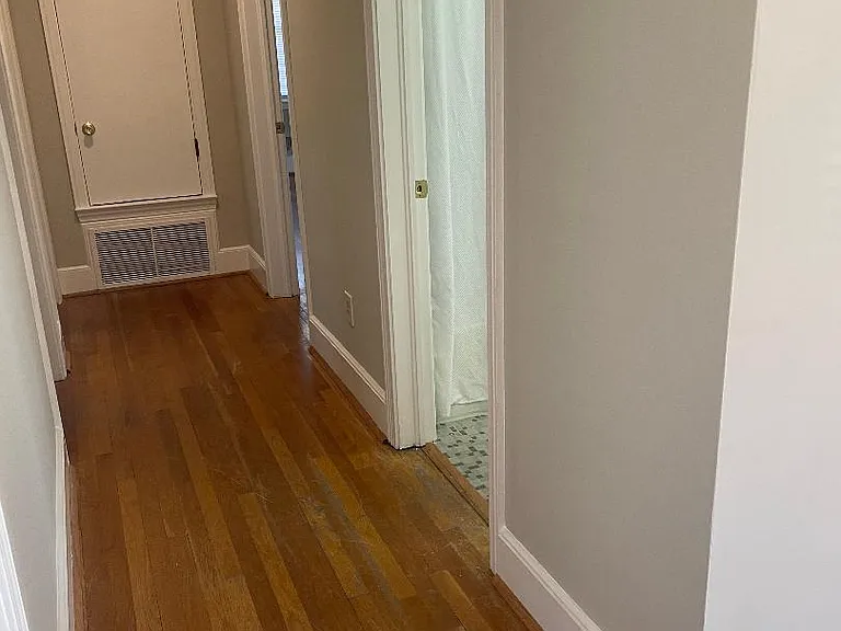 Hallway leading to bedrooms and linen closet.
